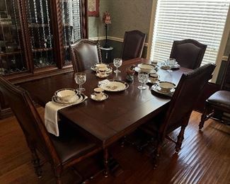 Massive dining table with 2 leaves and six chairs by Aspen Home. Lovely dinner ware service for 4