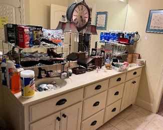 Lots of bathroom accessories and cleaning supplies