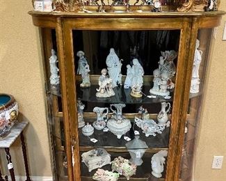 Curio cabinet full of collectible 