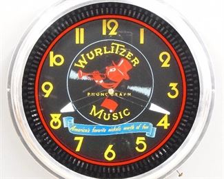 A modern Wurlitzer Phonograph gallery clock.  Electric movement with spinner and neon ring.  Chrome finish metal case.  Working order.  20" diameter.  ESTIMATE $100-150
