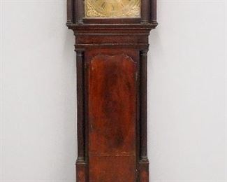 A late 18th century English grandfather clock.  8-day weight driven time and strike movement by "George Lupton, Altrincham" with square Brass dial, Silvered chapter ring and cast spandrels, subsidiary seconds and date aperture.  Mahogany case with broken arch top, glass panels in frieze, shaped dial door flanked by pairs of reeded fluted columns, over a shaped waist door with inlaid detail, reeded column and a base with quoin corners.  Old finish with some wear, lacks feet, minor case damage, repaired dial, running momentarily when cataloged.  90 1/2" high.  ESTIMATE $400-600
