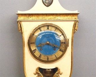 A 20th century Union-Stjarnsunds Swedish gallery clock.  8-day time and strike movement with Blue enameled dial and Roman numerals.  Shaped wooded case with original painted finish.  Minor wear, running when cataloged.  24" high.  ESTIMATE $100-150
