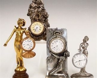 Four 20th century figural watch holders.  Various cast metal bodies, with display watches. Two are 1920s' era and two are modern.  Slight wear, watches As/Found.  Up to 7 1/2" high.  ESTIMATE $100-150

