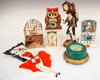 Five late 20th century novelty/animated clocks, a singing bird automaton and a bank.  Includes German, Japanese, etc.  Some wear, German Cat clock lacks weights, the Japanese Kewpie lacks the dome, As/Found.  ESTIMATE $100-150
