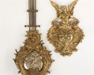 Two fancy German wall clock pendulums.  One with gridiron rod, one lacks rod.  As/Found.  Up to 14" long.  ESTIMATE $20-30
