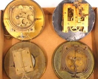 Four wall clock movements.  Includes two  weights and one  weight movement with dials, and a time and strike spring movement only.  As/Found.  ESTIMATE $50-100
