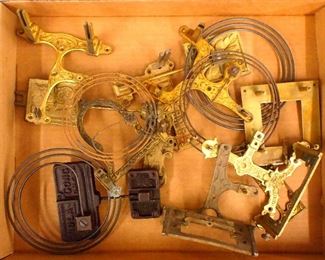 A collection of clock hangers and gongs.  Includes four hangers and four gongs plus miscellaneous parts.  As/Found.  ESTIMATE $20-30
