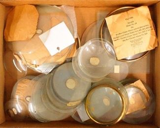 A collection of clock bezels and glasses.  Includes French convex glasses, approx. forty pieces total.  As/Found.  2 1/2 to 6 1/2" diameter.  ESTIMATE $20-30
