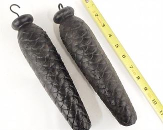 Two cuckoo clock weights.  Cast Iron pine cone design.  8.2 and 8.1 lbs.  As/Found.  Up to 10 1/2" long.  ESTIMATE $50-75
