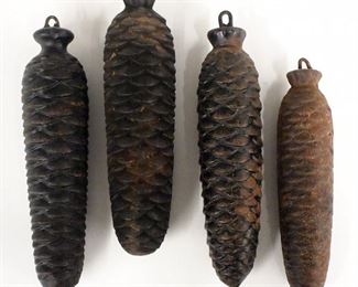 Four cuckoo clock weights.  Cast Iron pine cone design.  3.4 to 6.5 lbs.  As/Found.  Up to 9" long.  ESTIMATE $50-75
