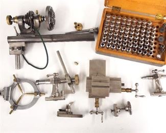 A turn of the century Boley & Leinen 6mm watchmaker's lathe.  Steel body with Brass fittings, numerous attachments include a 6-jaw chuck, fixed and feeding tailstocks, center rest, sliding table, small tool rest and a wooden box with collets.  Wear, minor damage, some missing collets.  10 1/4" beam.  ESTIMATE $300-400
