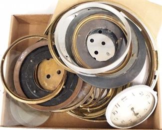 A collection of clock bezels and glasses.  Approx. fifteen pieces total.  As/Found.  Up to 12" high.  ESTIMATE $20-30
