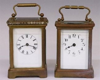 Two early 20th century Carriage clocks.  One a French 8-day time only movement with platform escapement and a porcelain dial with Arabic numerals, the other a Waterbury 8-day time and strike movement with repeat button and a porcelain dial with Roman numerals.  Molded Brass cases with beveled glass panels, Waterbury with applied "brilliants" trim.  Some wear to both cases and dials, damage to glass, missing several "brilliants", wound tight, not running when cataloged.  Up to 4 1/2" high.  ESTIMATE $300-500

