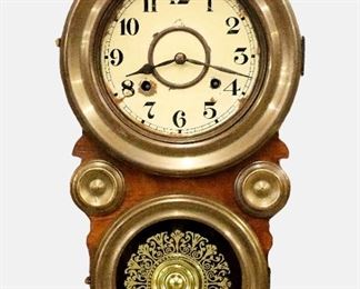 A mid 20th century Japanese wall clock.  8-day time and strike movement with a two-part painted metal dial and Arabic numerals.  "Figure 8" Walnut case with Brass bezels, applied Gilded bosses and stenciled lower glass.  Old finish with some wear, replaced dial with wear and flaking, running when cataloged.  19 3/4" high.  ESTIMATE $300-500
