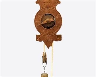 A reproduction "Columbus" model wall clock.  30-hour wooden works weight driven time only movement with "flying" pendulum, an embossed wooden dial, Arabic numerals and single hand.  Original finish with some wear, running when cataloged.  Case is 14" high plus weight drop.  ESTIMATE $100-150
