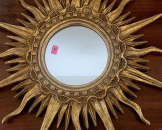 Heavy gold Sun mirror.