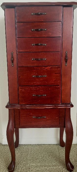 y Armoire.  Has two extendeding doors on side,  6 drawers, and center console for jewelery.