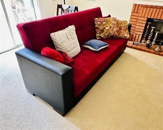 Red micro fiber couch, lays out into full size fully supported bed.  comes with matching adornment pillows.