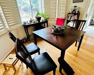 6 seating dark wood table, includes chairs, and seat covers.