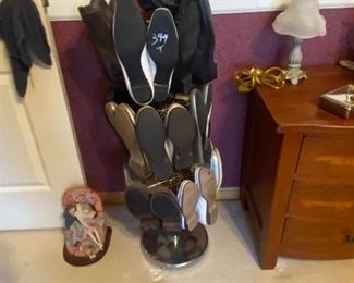 Shoe holder and several pairs of size 8 1/2 Womens shoes. 2 differ pair of gold shoes too in sale 