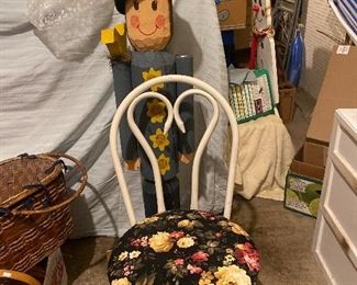 Metal chair . Wooden yard figurine 
