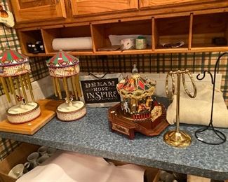 Carousels, sign, wooden cutting board, towel rack