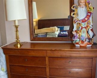 Dresser with mirror, lamp, Buddha statue