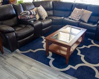 Sectional couch, coffee table, area rug