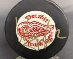 Signed Slava Fedison Red Wings Hockey Puck