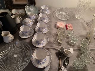 blue and white cups and saucers with cream and sugar