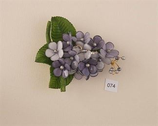 Brooch stamped “Paris”.