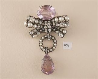Iradj Moini Silver Tone Brooch measures approx. 73mm in width x 118mm in length. Amethyst, clear faceted stones, faux pearls. 