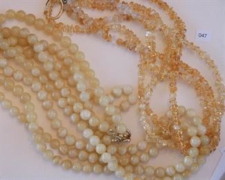 Necklace measures 30” in overall length. Four strands of polished round beads - pale yellow agate. 40” in length and the beads are approx. 10mm in diameter. Looped through the agates are 3 strands of polished citrine chip beads measuring approx. 19” in length.
