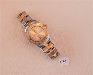 Tag Heuer stainless and 18 kyg. 28mm in diameter. Model number “WN 1353 OXE6196”.  Quartz movement.