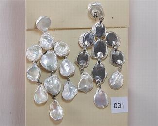 Simon Tu pierced friction post silver tone metal earrings. Each earring has 11 fully drilled keshi fresh water pearls.