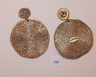 Roni Blanshay pierced gold tone. Each earring measure approx. 2 9/16” in length. The top round section is about 9/16” in diameter and pave set with faceted foil back yellowish stones. The drop is undulating circular form measuring approx. 1 7/8” in diameter with a border of the same faceted foil back yellowish stones and multiple stones set within the gold tone fine mesh center.