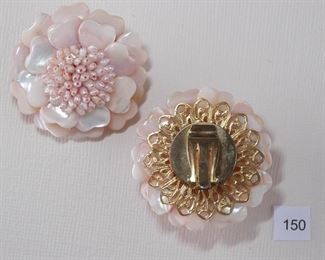 Clip back gold Tone. Each round form measures approx. 1 9/16” in diameter and consists of two overlapping layers of pink mother-of-pearl shaped beads with a center cluster of pink, rice shaped, fresh water pearl beads.