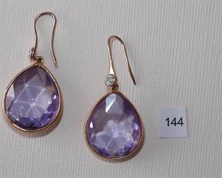 Henri Bendel pierced earwire gold Tone. 1 3/4” in length. Pear shaped stone, pale amethyst, bezel set.