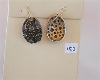 Alexis Bitter. Gold tone earrings measure approximately 1 1/2” in length. The oval drop measures approximately 1 1/8x7/7”. The drop is set with multiple round blue and green cabochon stones of different sizes.