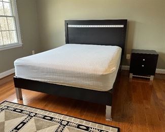 Huppe black with chrome trim queen sized platform bed & 2 drawer end table