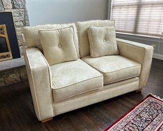 American Signature cream suede 2 seat loveseat (60"W x 43"D x 38"H)