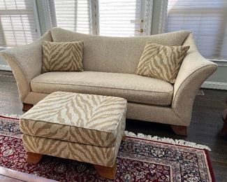 American Signature cream sofa (96"W x 42"D x 40"H) with zebra pattern ottoman and accent pillows