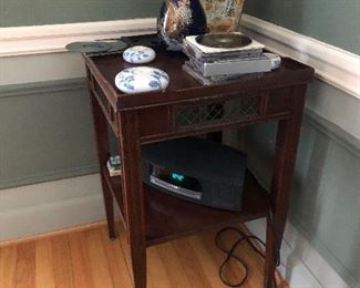 Mahogany square table with vases 