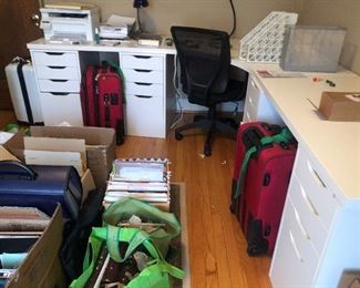 White drawer bases like the gray ones - with a custom top that sits on them.  Can be sold separately - desk chair - lots of stuff in boxes to be displayed on table for the sale 