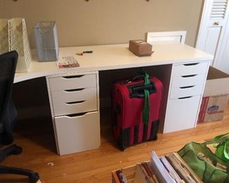 close up - of the white storage drawers - suitcases 