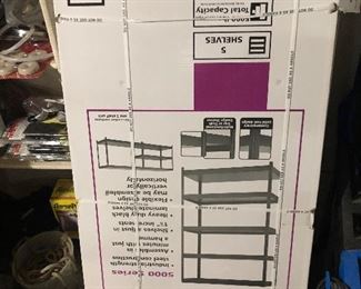 2 new heavy duty black shelving systems still in box with black laminate shelves 