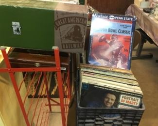 Records, toy train and trucks in boxes 