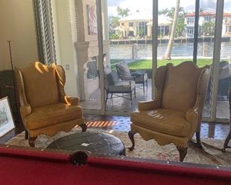 Set of two unique vintage leather wingback chairs - amazing condition . 