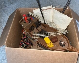 Vintage Playmobil pirate ship looks like it is complete with a lot of extra figurines