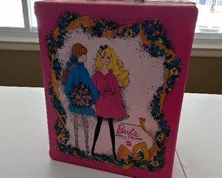 Barbie case full of dolls and accessories